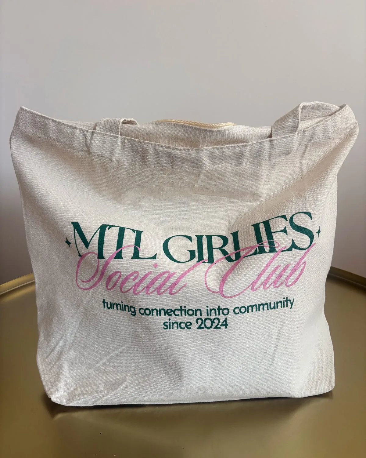 The MGS tote standing on a table, wordmark facing forward