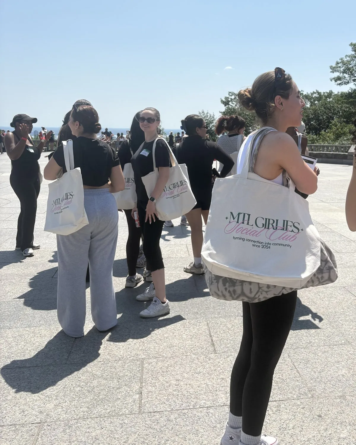 Members at the lookout, one with the MGS tote on her shoulder